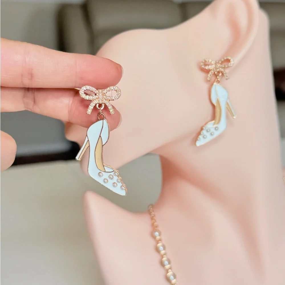 White Enamel High Heel Drop Earrings with Gold Bow